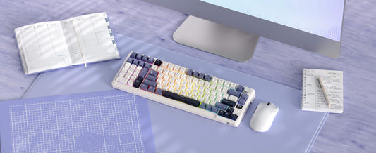 Programmer typing on a mechanical keyboard at a desk, focused on code on screen